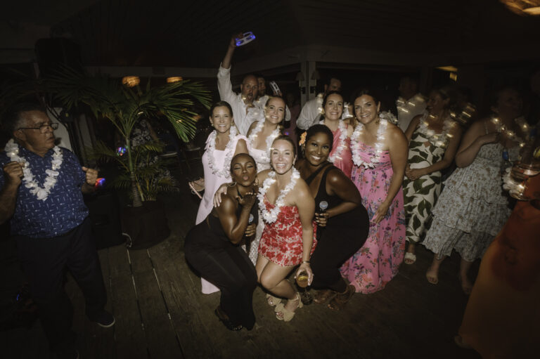 Wedding guests celebrating on the dance floor at night in The Bahamas