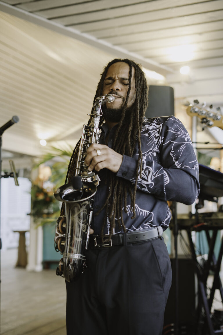 Saxophonist performing live at a BahamaMara event in The Bahamas